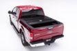 Red car with black hood and roof on bak 17-23 ford super duty 8ft bed bakflip f1