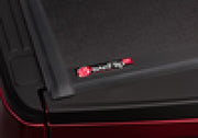 Red ford super duty truck bed with open door - bakflip g2