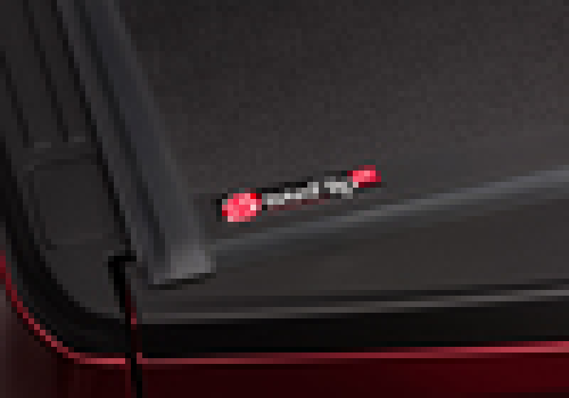 Red ford super duty truck bed with open door - bakflip g2