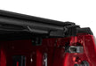 Red ford super duty with revolver x4s bed cover and roof rack