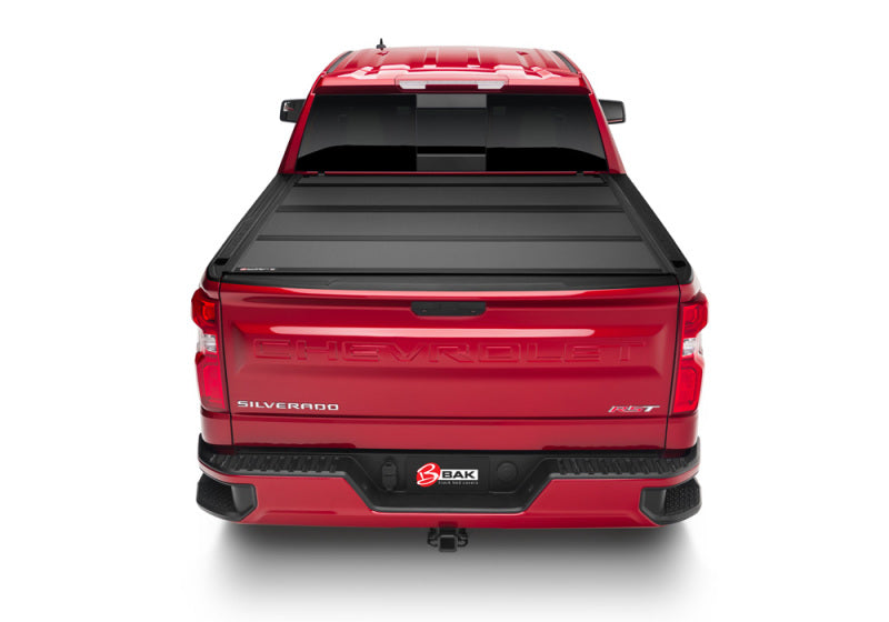 Red 2019 rambo truck rear view shown on bakflip mx4 for chevy silverado 1500’s 6ft 6in bed