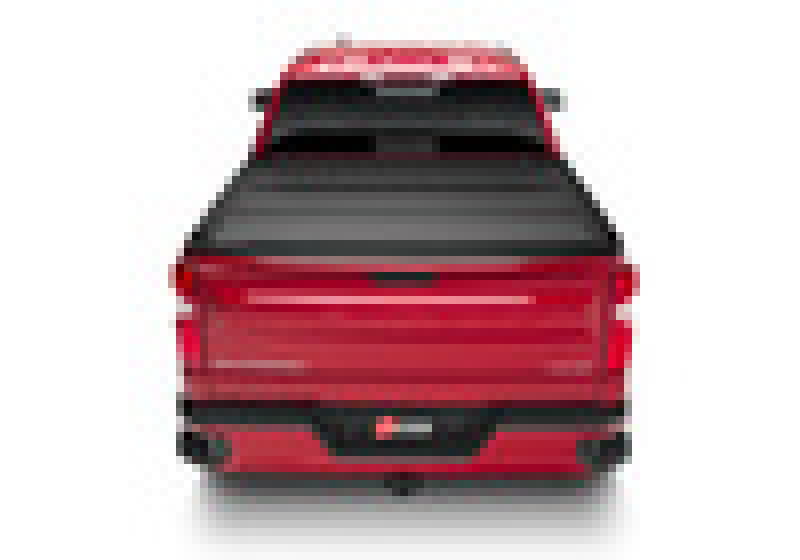 Red car with hood open next to bak 19-20 chevy silverado 1500 6ft 6in bed bakflip mx4 matte finish