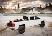 White chevy silverado 5ft 8in bed revolver x2 truck parked in snow