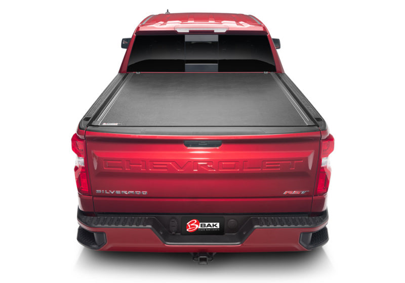 Red chevy silverado 5ft 8in bed with bed cover open