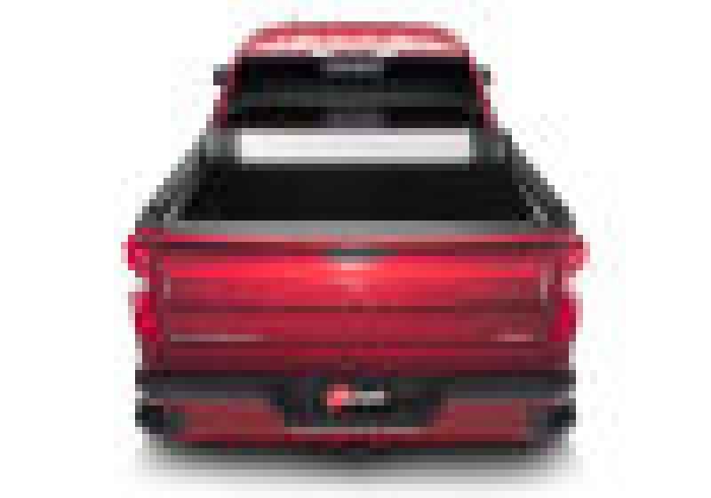 Red chevy silverado 5ft 8in bed revolver x2 with open hood