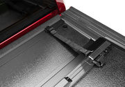 Bakflip g2 truck bed cover with rear door latch open and closed