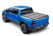 Blue truck with black bed cover on bakflip mx4 for dodge ram 1500 with installation instructions