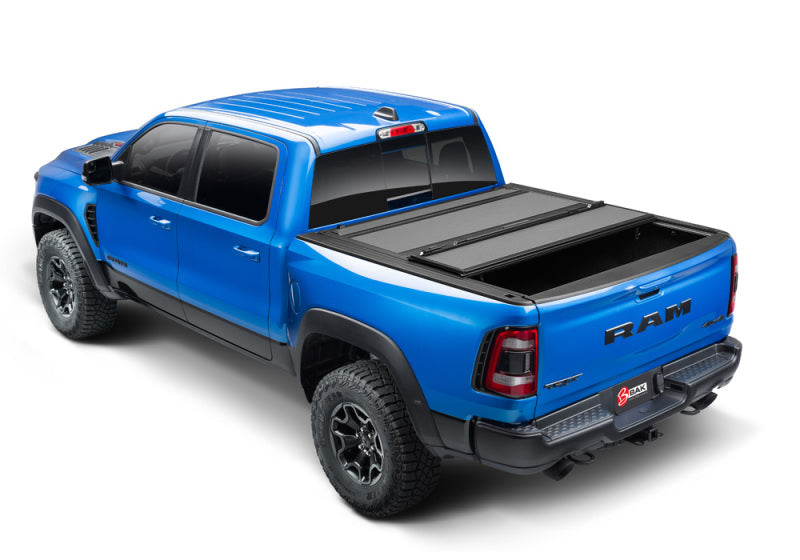 Blue truck with black bed cover - bak 19-20 dodge ram 1500 mx4 matte finish