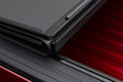 Red car with black roof on bakflip mx4 matte finish product for dodge ram 1500