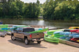 Truck parked next to kayaks with bakflip fibermax for dodge ram 1500 bed