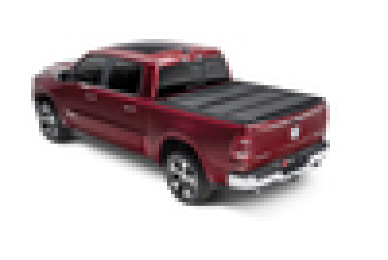 Red toy truck with black top displayed on bakflip mx4 matte finish for dodge ram 1500 bed