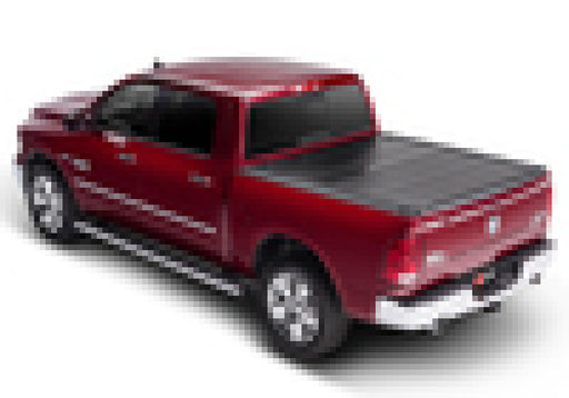 Red truck with black top on bak 19-20 dodge ram 5ft 7in bed bakflip f1