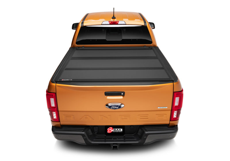 Yellow truck rear view with bak 19-20 ford ranger 5ft bed bakflip mx4 matte finish