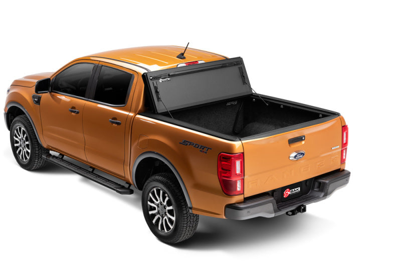 Orange ford ranger truck rear view with bakflip mx4 matte finish