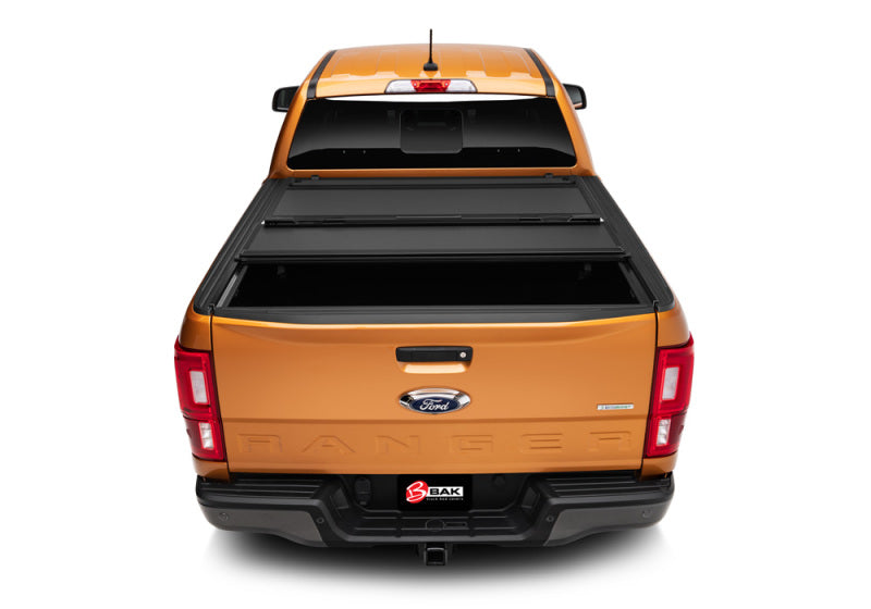 Yellow pickup truck rear view with bak 19-20 ford ranger bedflip mx4 installation instructions