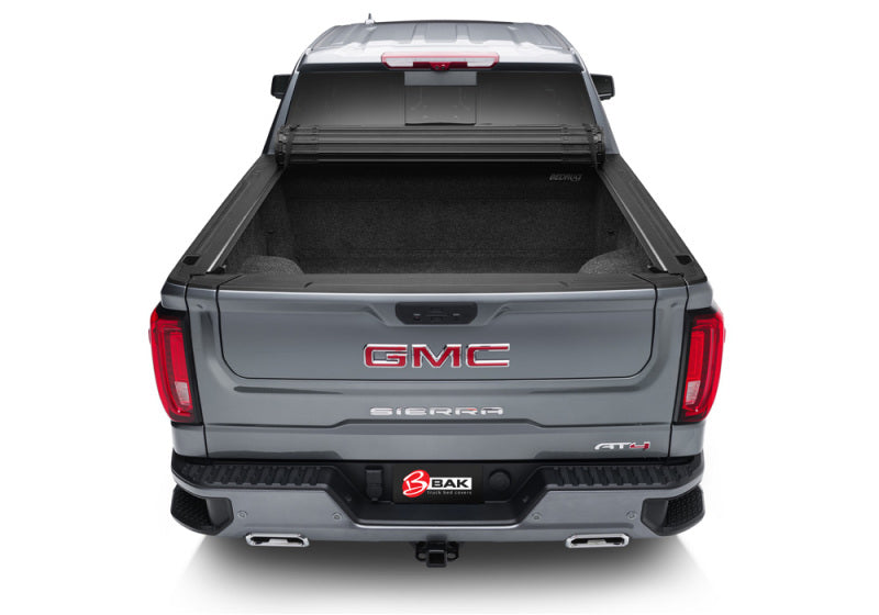 Gray gmc truck with bak revolver x4s bed cover 1500