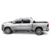White dodge ram with revolver x4s bed cover