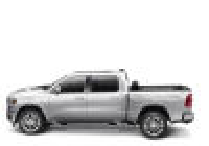 White dodge ram with revolver x4s bed cover