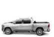 White dodge ram with revolver x4s bed cover