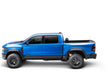 Blue truck bed cover for 19-21 dodge ram with revolver x4s on white background