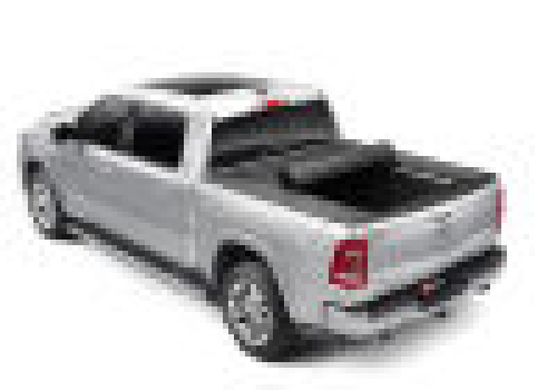 Remote controlled toy car next to bak revolver x4s bed cover