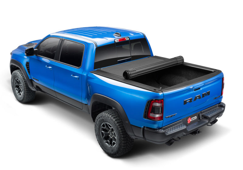 Blue truck with black bed cover - bak revolver x4s 5.7ft bed cover for 19-21 dodge ram (new body style