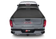 Rear view of gmc truck with bak revolver x4s bed cover