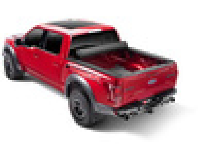 Red toy truck displayed in bak 20-21 chevy silverado revolver x4s bed cover