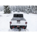 White truck parked in snow with BAK Revolver X4s bed cover.