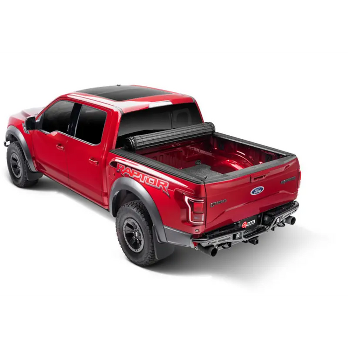 Red truck with black bed cover - BAK Revolver X4s for Jeep Gladiator.