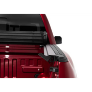 Red truck with roof rack displayed in BAK 20-21 Jeep Gladiator Revolver X4s 5ft Bed Cover.