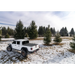 White Jeep parked in snow with BAK 20-21 Jeep Gladiator Revolver X4s 5ft Bed Cover