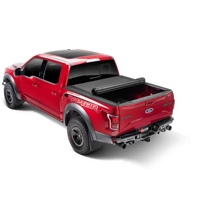 Red truck with black bed cover - BAK Jeep Gladiator Revolver X4s 5ft Bed Cover.