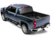 Toy car with red top and black wheels displayed on bak 2020 chevy silverado 2500/3500 hd 6ft 9in bed b