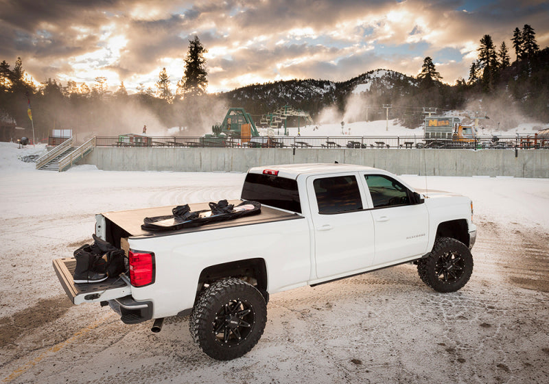 White truck parked in snow, bak 2020 chevy silverado 2500/3500 hd 6ft 9in bed revolver x2