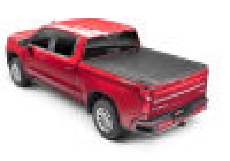 Red toy truck with black top displayed in bak 2020 chevy silverado 2500/3500 hd 6ft 9in bed revolver x