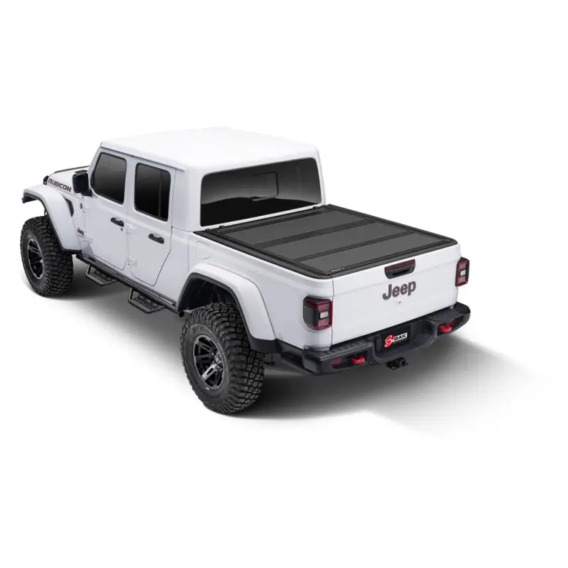 BAK 2020 Jeep Gladiator 5ft Bed BAKFlip MX4 white truck with black top and tires