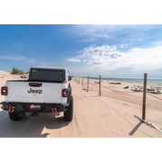 White truck parked on beach - BAK 2020 Jeep Gladiator 5ft Bed BAKFlip MX4.