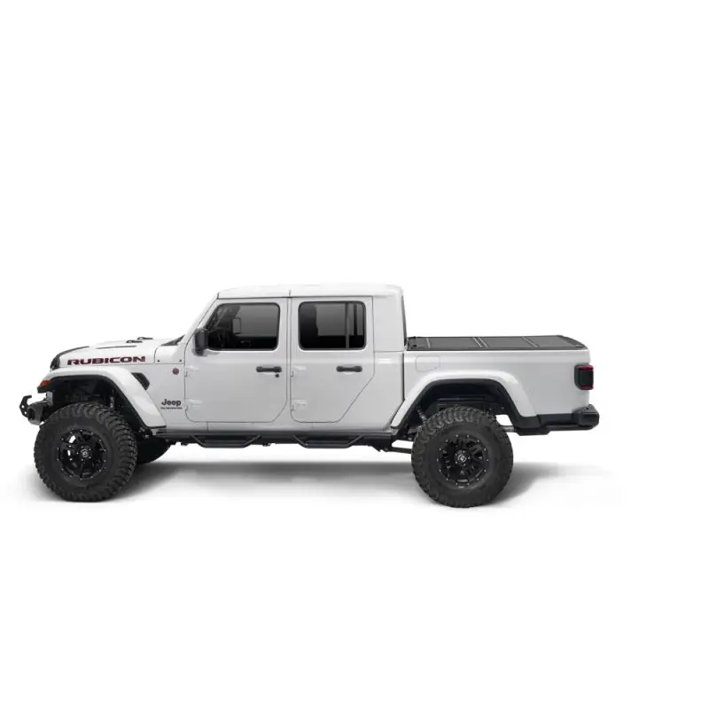 White Jeep Gladiator 5ft Bed BAKFlip MX4 with black bumper and wheels