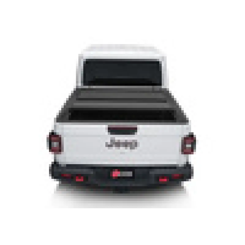 White Volkswagen SUV rear view - BAK 2020 Jeep Gladiator 5ft Bed BAKFlip MX4