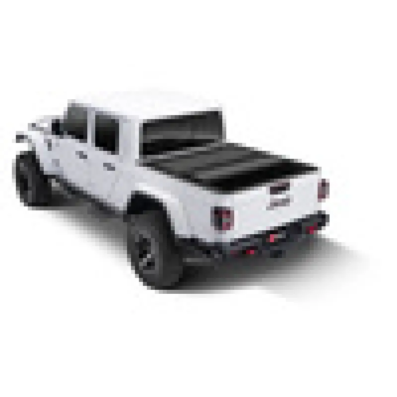 White and black BAK 2020 Jeep Gladiator 5ft Bed BAKFlip MX4 truck.
