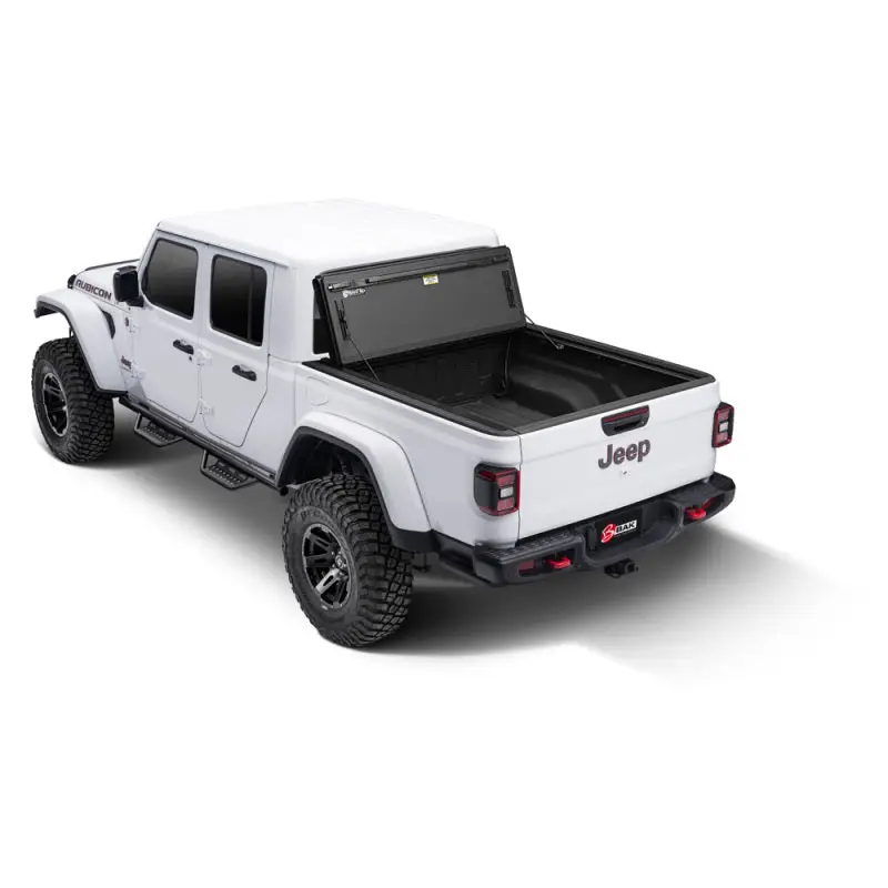 White truck with black bed cover on BAK 2020 Jeep Gladiator 5ft Bed BAKFlip MX4