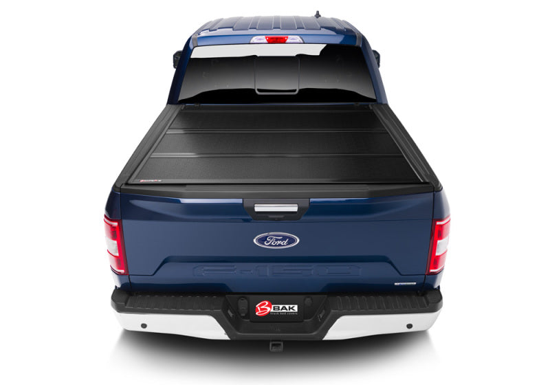 Blue truck bed cover with tail light on - bak 2021+ ford f-150 regular super cab & super crew (4 door) bakflip g