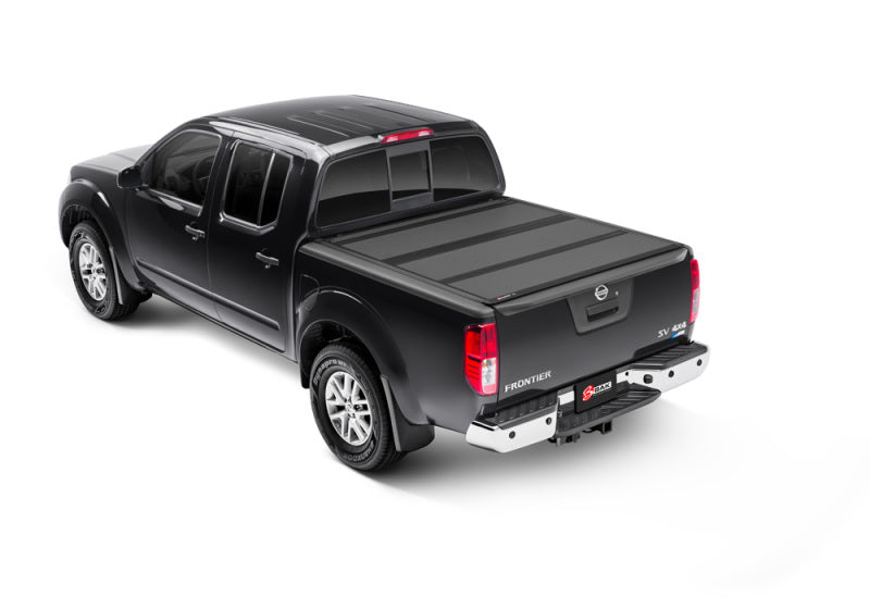 2022 nissan frontier with black bed cover by bakflip mx4
