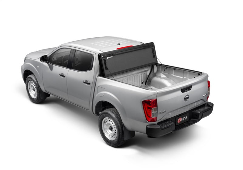 2022 nissan frontier 5ft bed bakflip mx4: rear view of silver pick truck