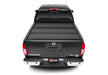 Rear view of black truck bed cover for 2022 nissan frontier - bakflip mx4