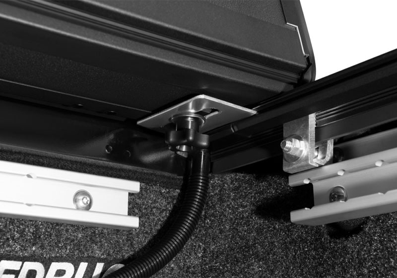 Black and white trailer with trailer hitch - bak 2022 nissan frontier bed bakflip mx4