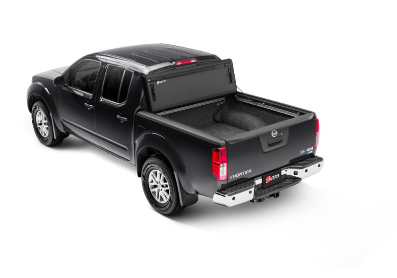 Product image showing the black truck bed of bak 2022 nissan frontier 6ft bed bakflip mx4 matte finish