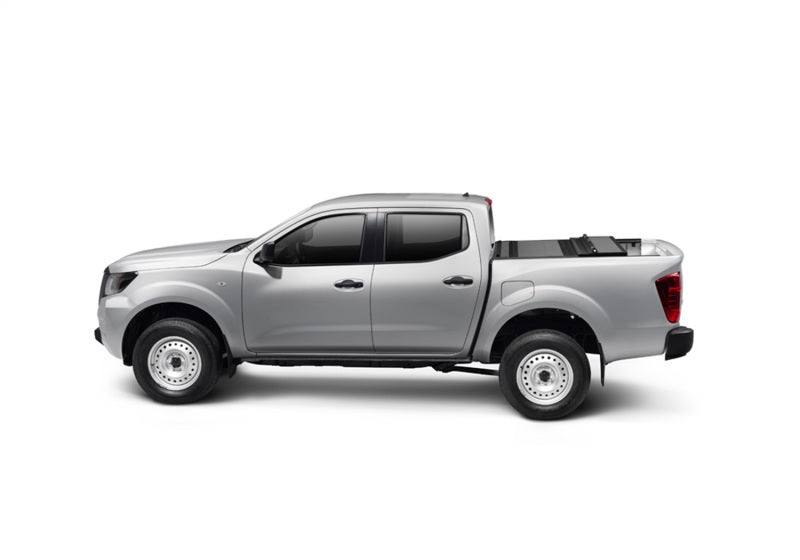 Silver pickup truck on bak 2022 nissan frontier 6ft bed bakflip mx4 matte finish