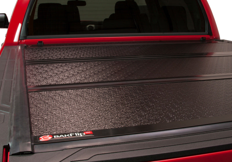 Red and black bak 2022+ toyota tundra 5.5ft bed fibermax bed cover installed on truck bed